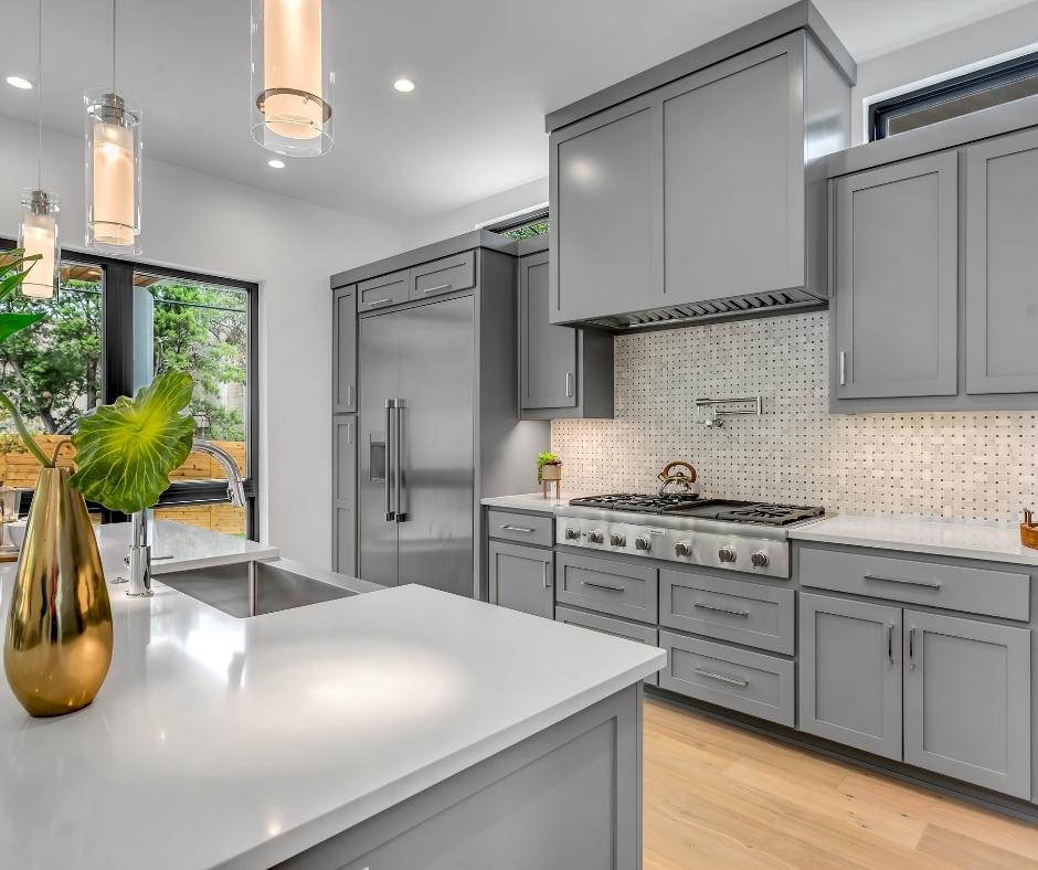 Modern white and grey kitchen with tap water running